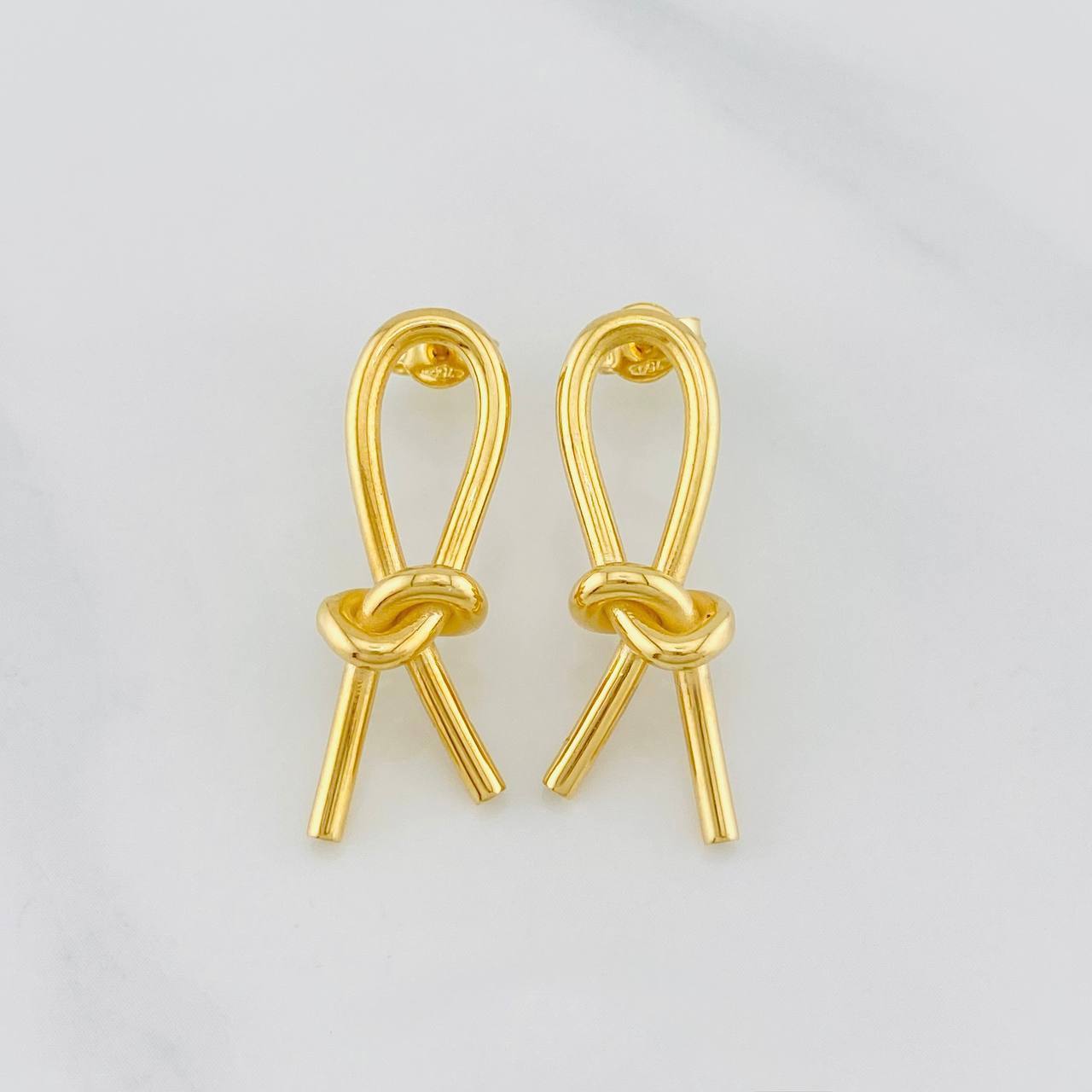 Topos Moño en oro amarillo 18K