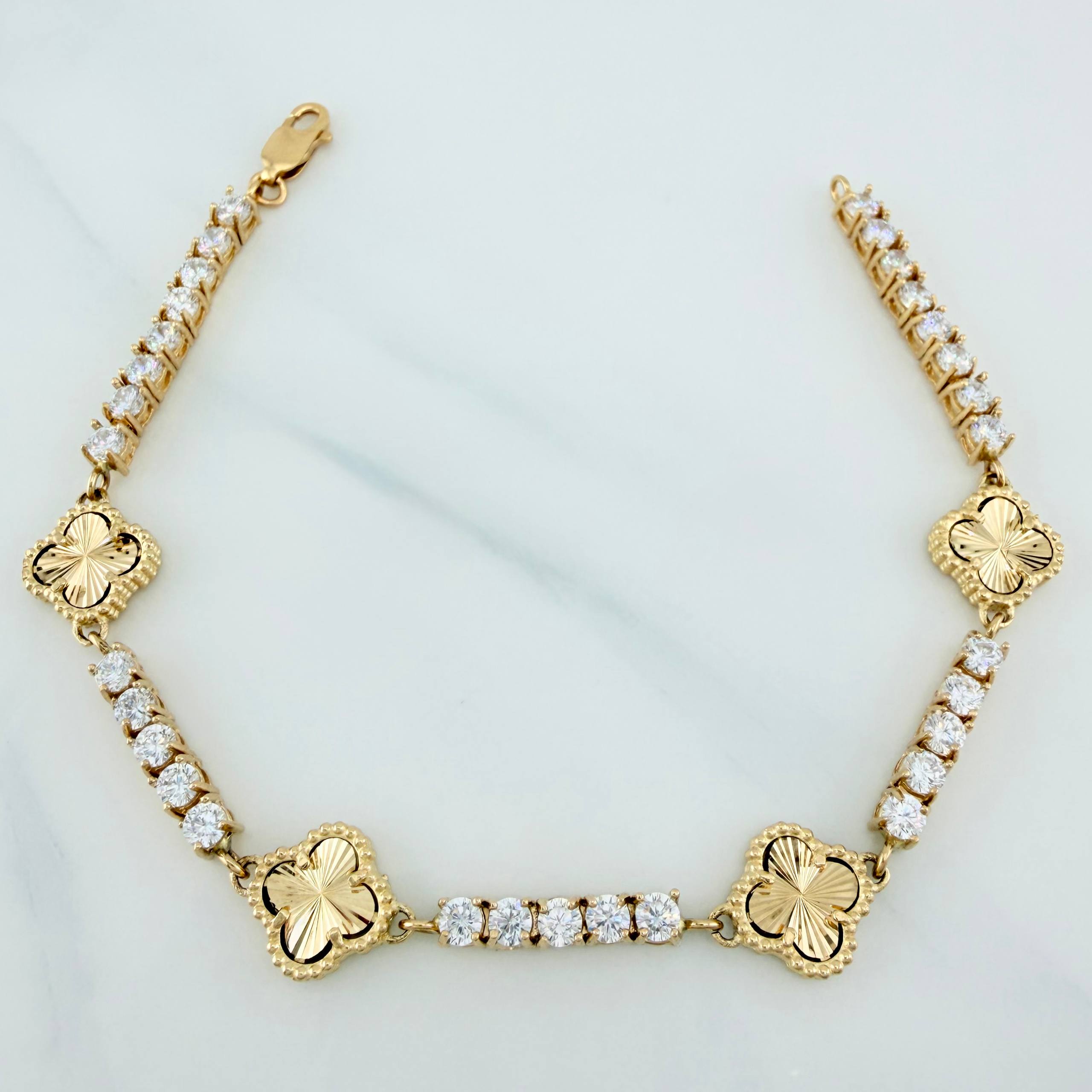 Pulso Tennis Trébol de oro amarillo 18K con circones