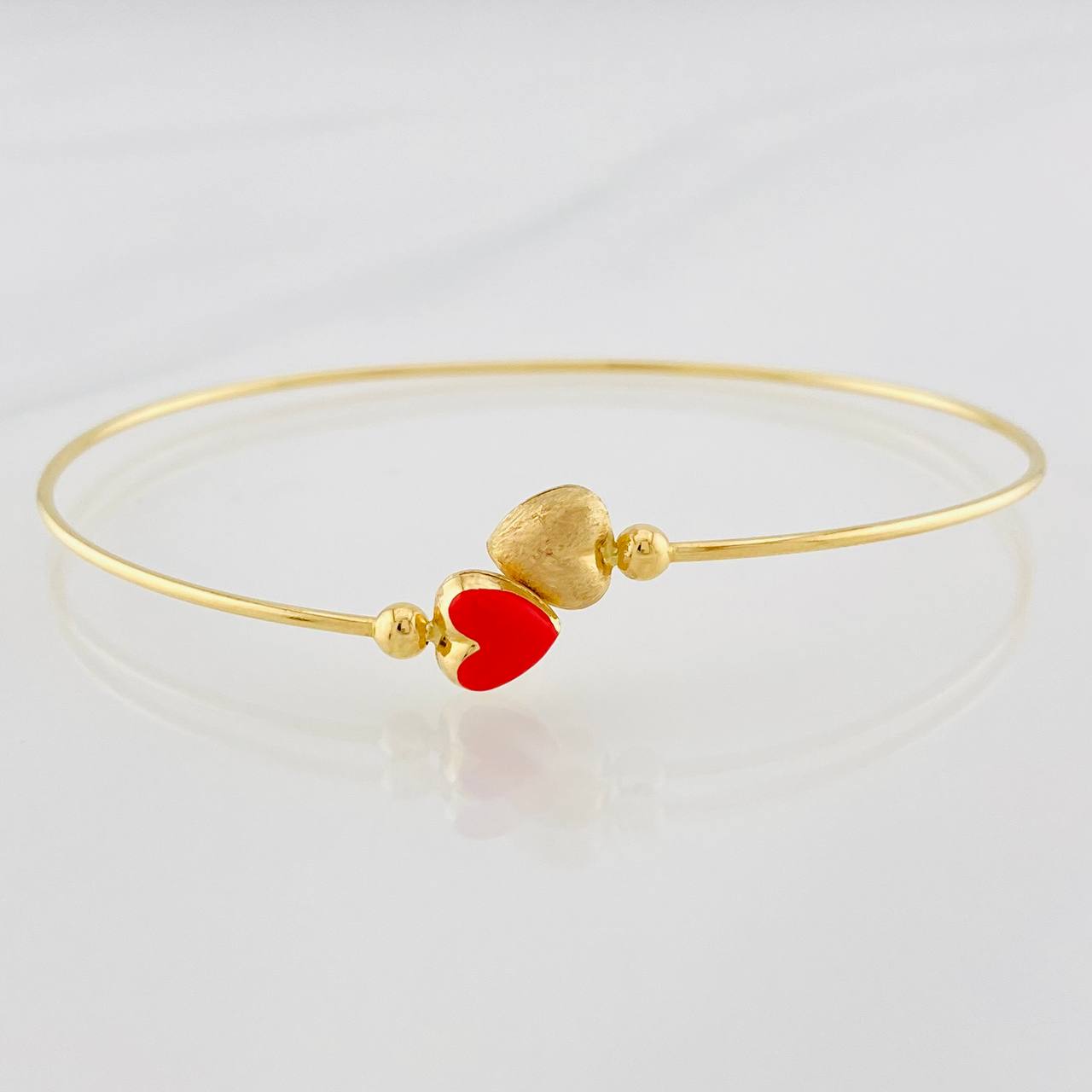 Pulso Aro Corazones en oro amarillo 18K