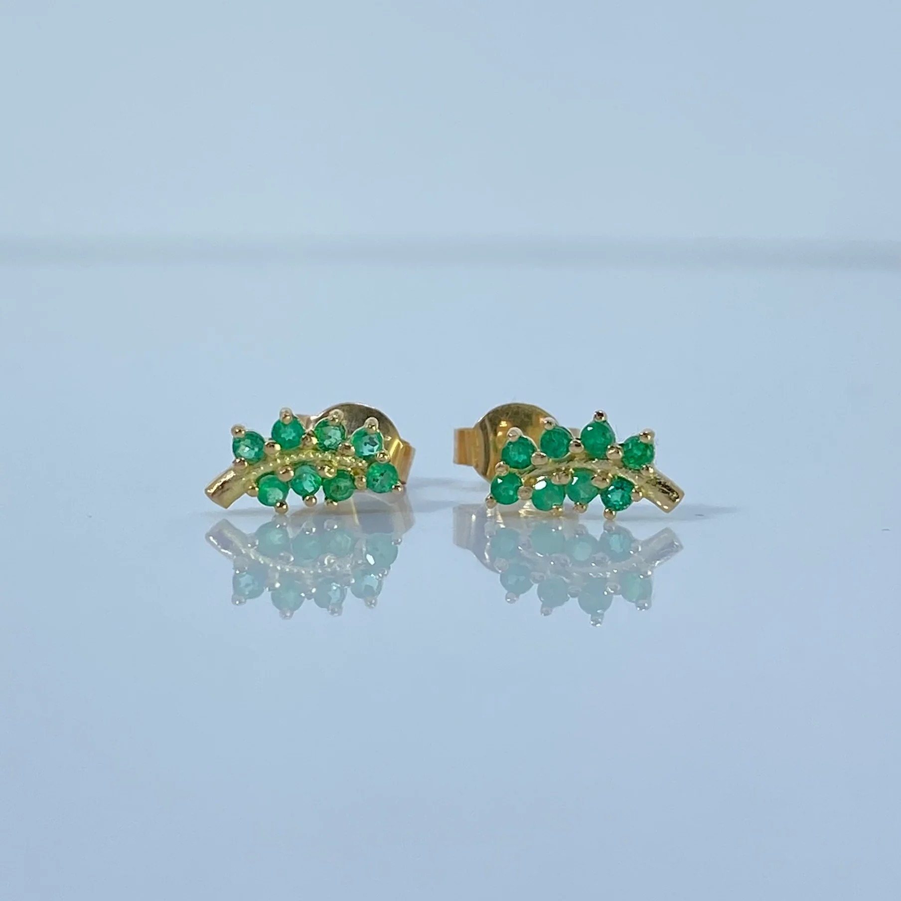 Topos Cruz de oro 18K con esmeraldas